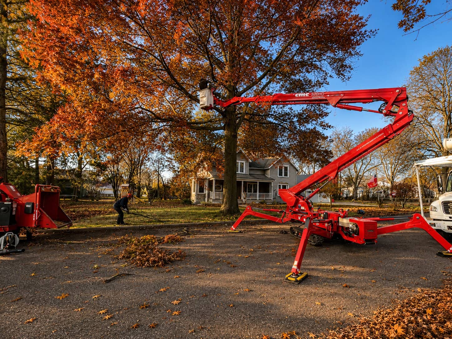Wellner Arboriculture crew pruning a large oak from a compact lift